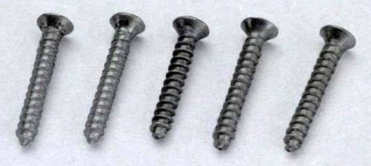 Cinq vis en métal disposées de manière uniforme sur une surface claire, têtes tournées vers le haut. Elles possèdent un profil cruciforme.