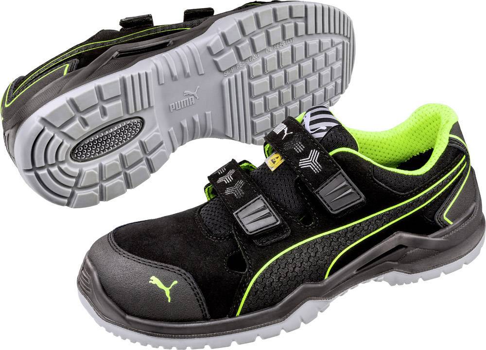 Chaussure de sécurité noire avec semelle grise et accents verts, incluant une fermeture velcro, logo Puma sur le côté et doublure intérieure rembourrée.