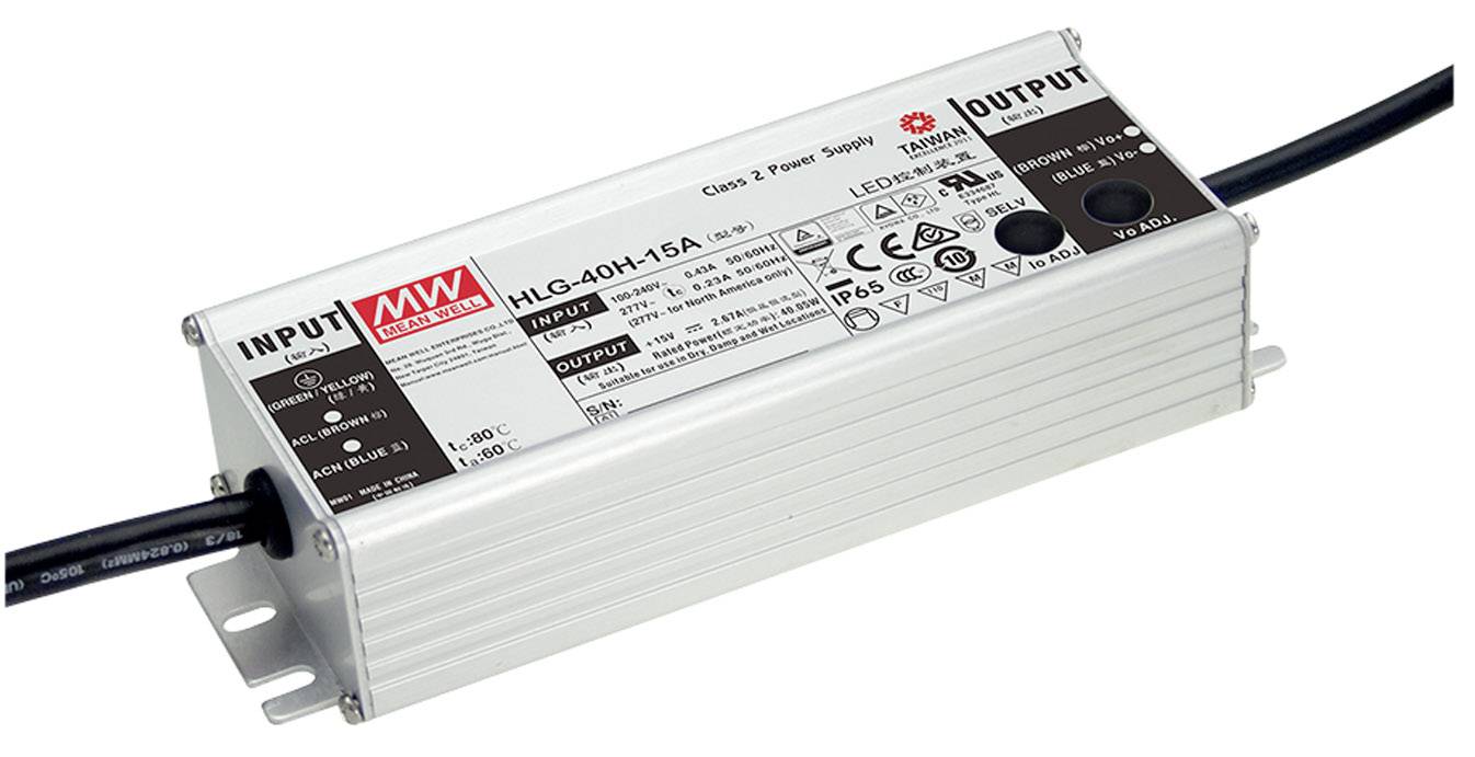 Un bloc d'alimentation rectangulaire portant l'inscription 'Mean Well HLG-40H-15A'. Il dispose d'entrées et de sorties marquées ainsi que des symboles techniques.