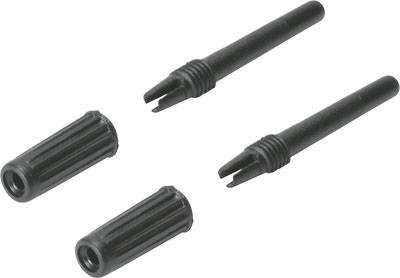 Quatre broches d'adaptateur noires à pointes arrondies et rainurées, deux avec des extrémités ouvertes et deux avec des capuchons fermés.