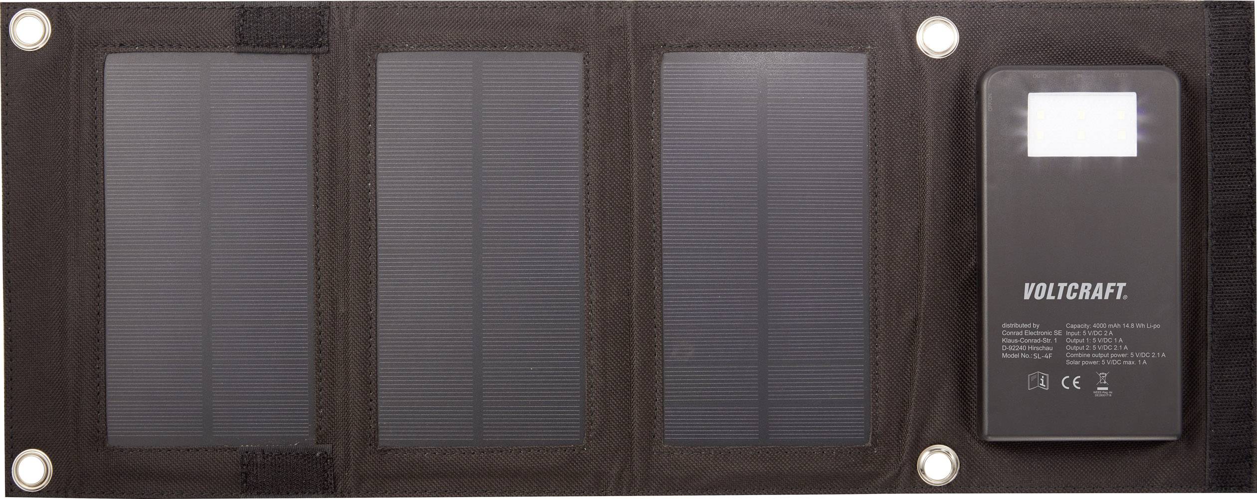 Chargeur solaire avec trois panneaux solaires et une batterie externe. Le nom du produit 'Voltcraft' est inscrit sur la batterie externe, accompagné des logos CE et d'autres certifications.