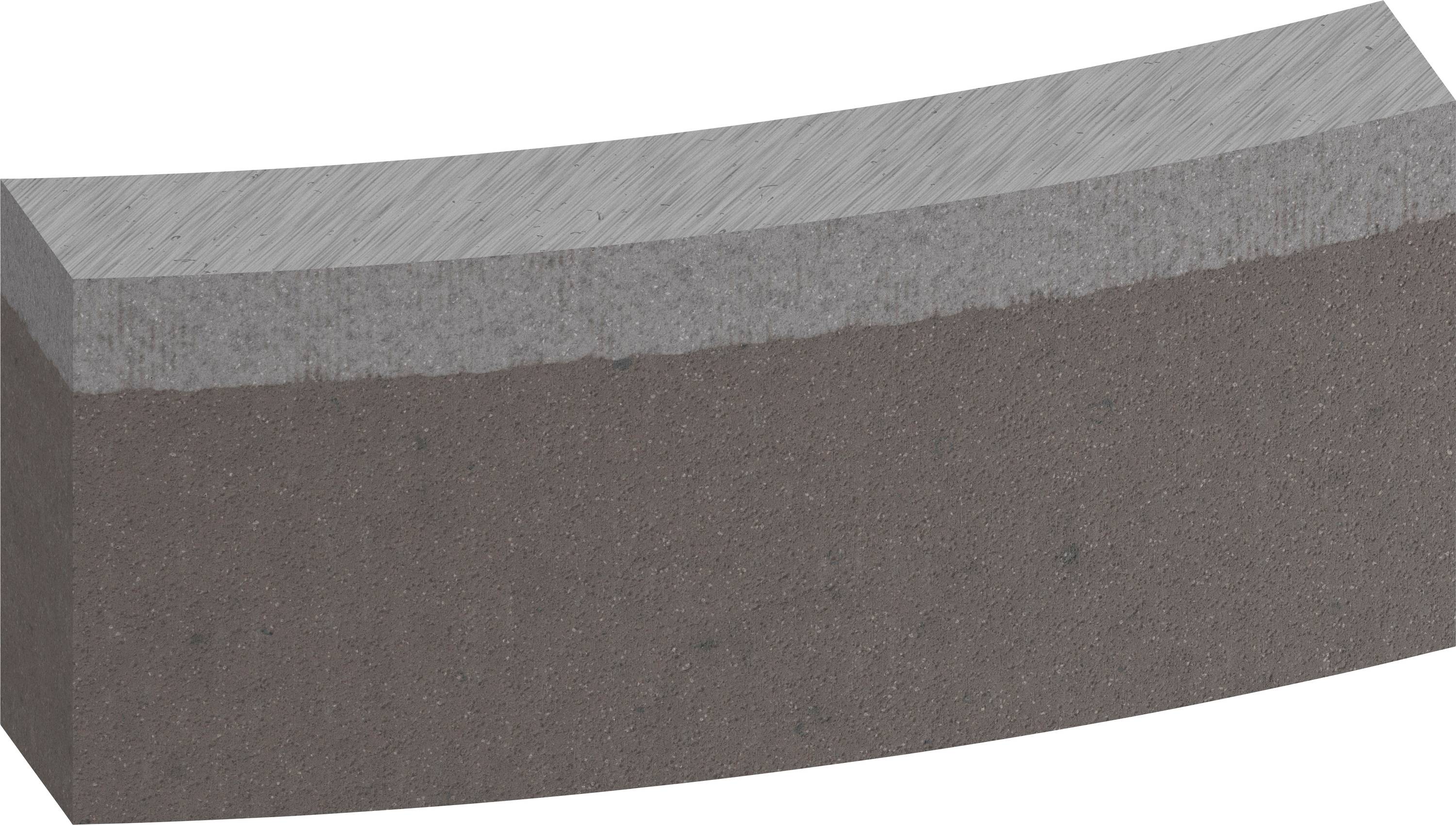 Bloc gris en demi-cercle, composé de deux couches aux ombres différentes. La surface supérieure est plus claire que le reste.