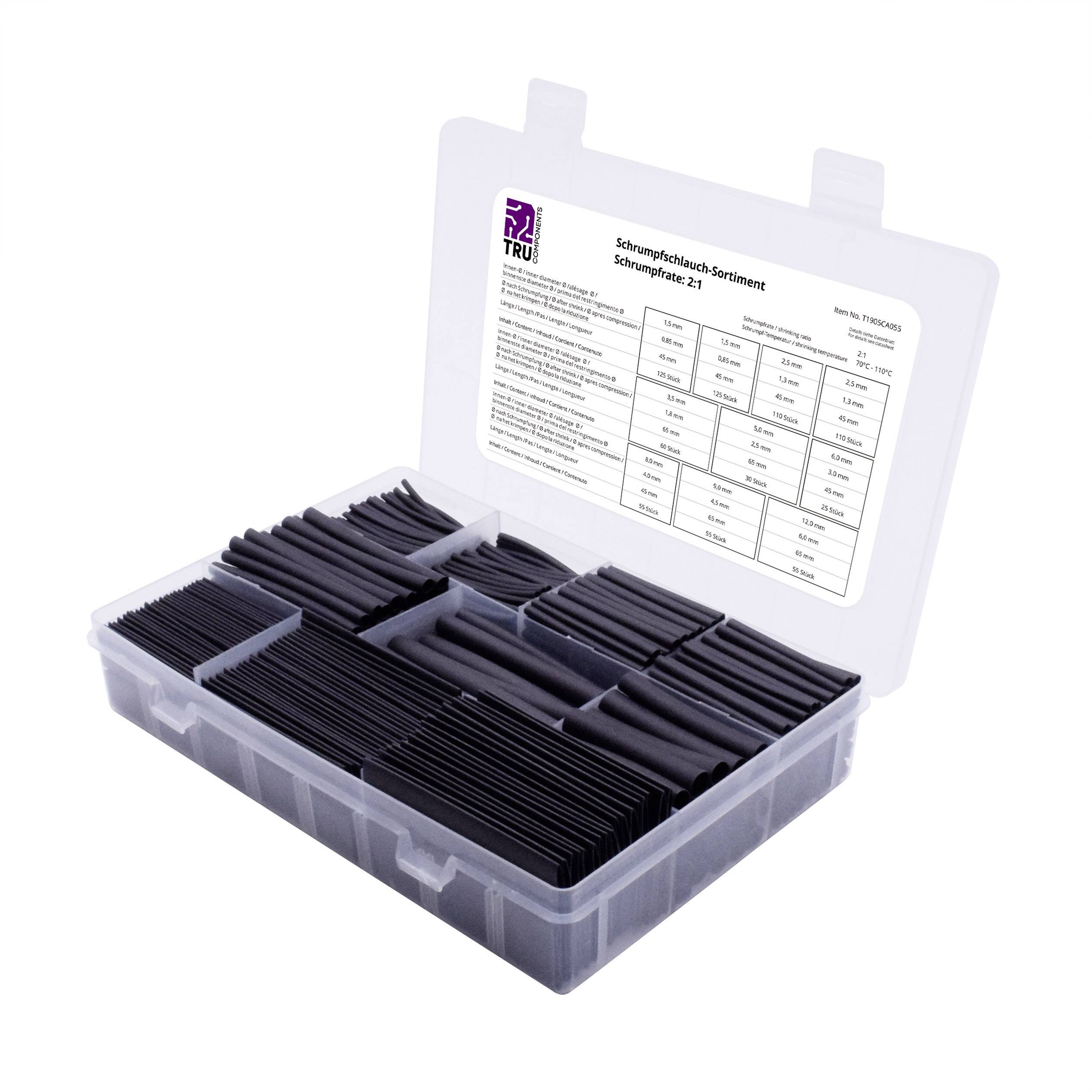 Une boîte en plastique ouverte présente une collection de gaines thermorétractables de différentes tailles et longueurs. Une étiquette avec des détails est apposée sur le couvercle.