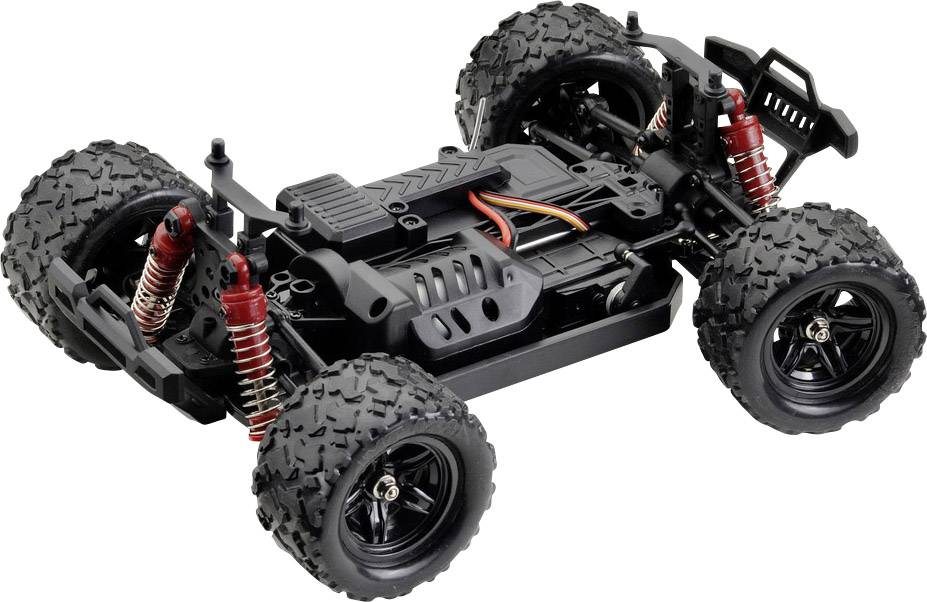 Voiture télécommandée sans carrosserie, montrant l'intérieur avec quatre grandes roues tout-terrain et des amortisseurs rouges.