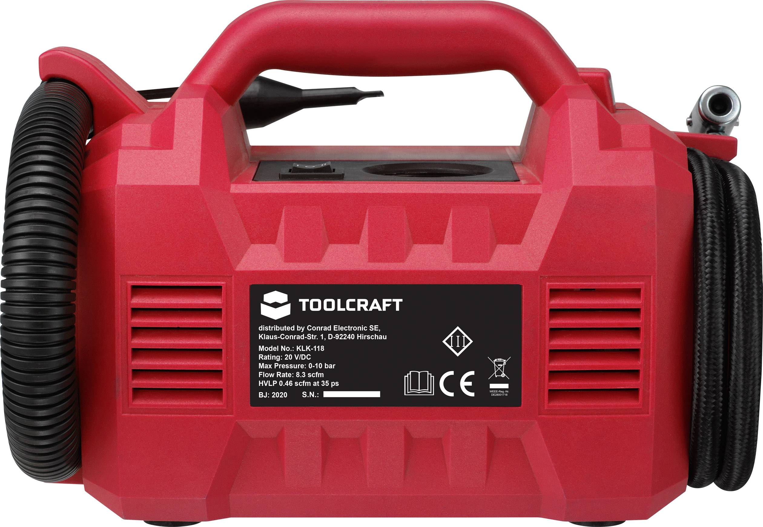 Compresseur rouge avec poignée de transport et flexible spiralé noir. L'étiquette avec les spécifications indique la marque Toolcraft et les données techniques.