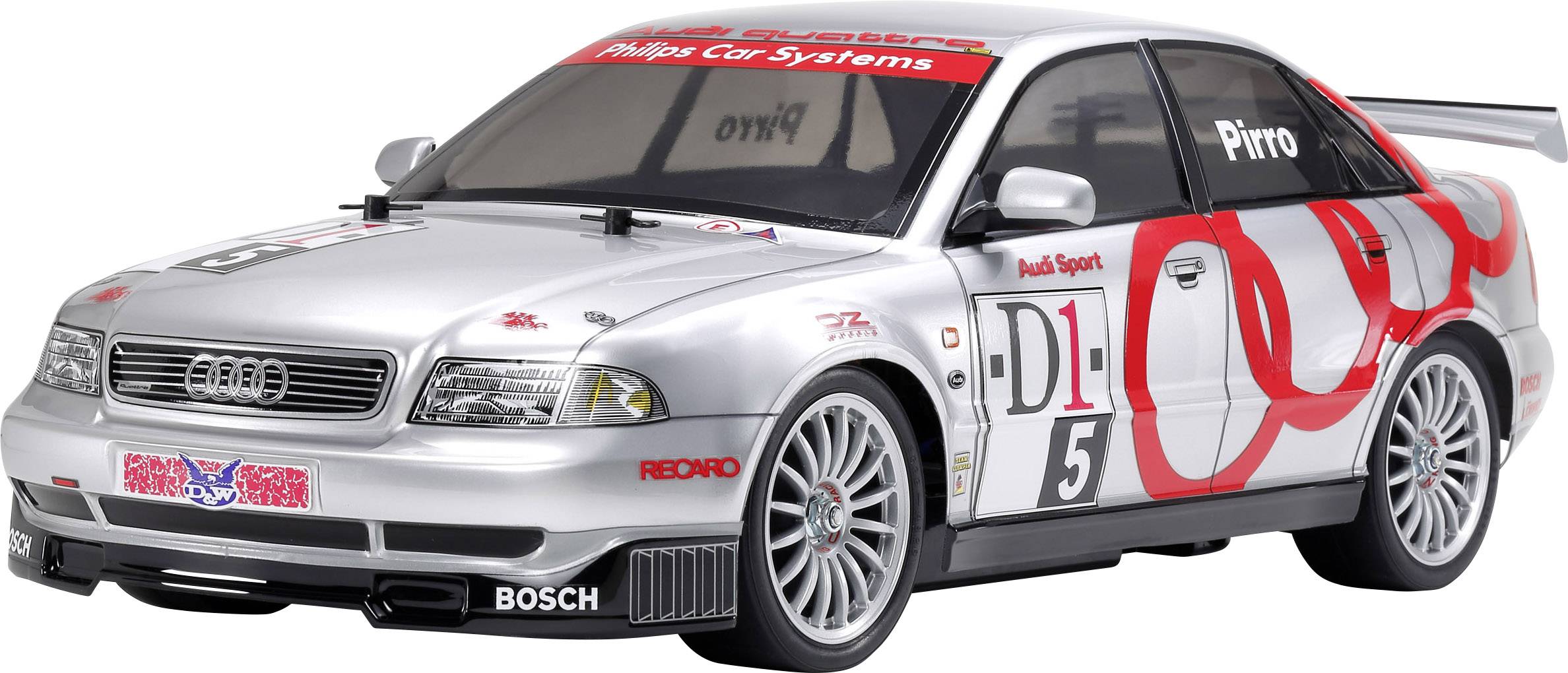 Voiture de course argentée avec des autocollants rouges et noirs, numéro 5 sur le côté. Logo Audi sur l'avant, design sportif.