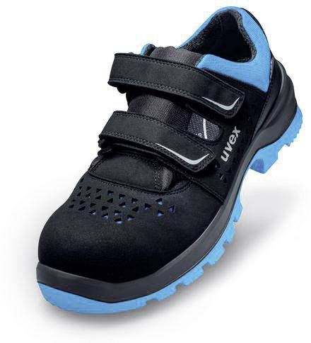 Chaussure de sécurité noire et bleue avec fermeture velcro et insertions respirantes. Adaptée aux environnements de travail, offrant protection et confort.