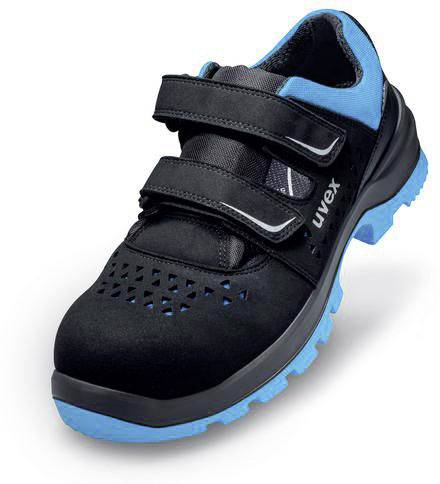Chaussure de sécurité noire avec des touches bleues et des fermetures velcro, marquée du nom de la marque sur le côté.