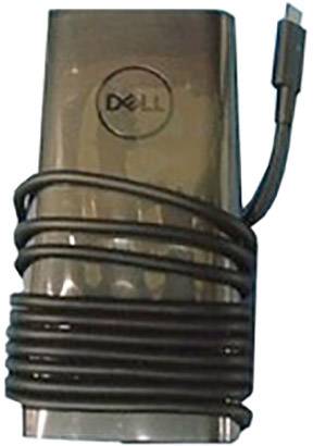 Un chargeur noir de la marque Dell, avec un câble enroulé, est posé à plat sur une surface.