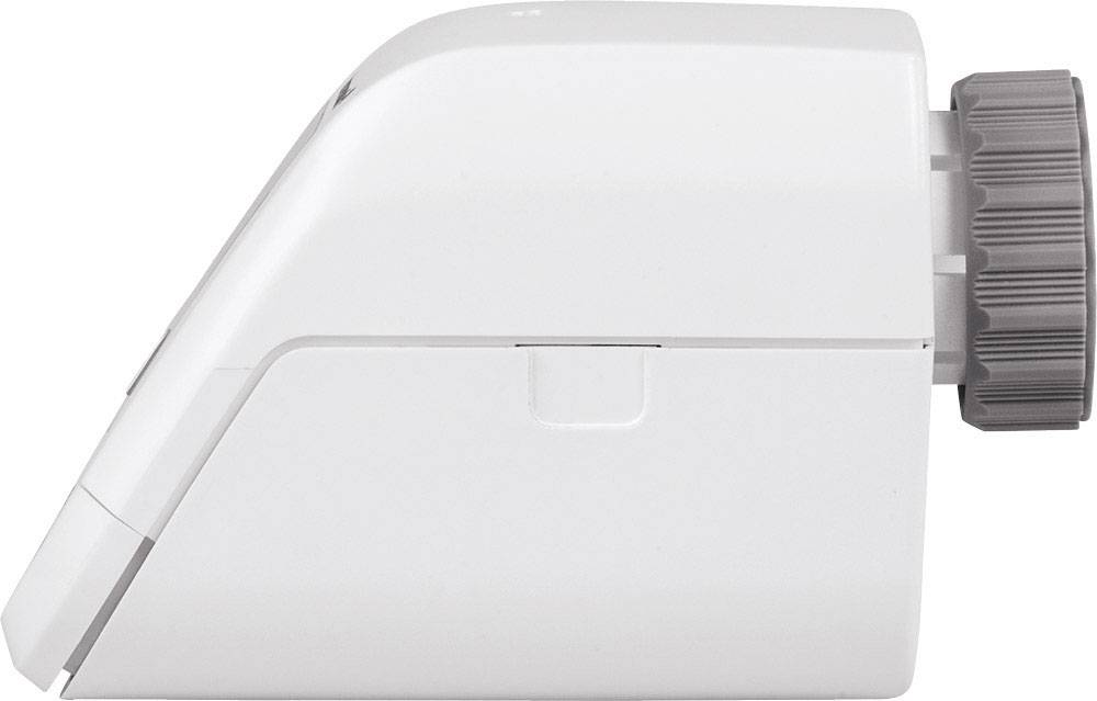 Appareil blanc avec un bouton rotatif gris sur la droite. Vue latérale révélant un design élégant et moderne. Fonction indéterminée.