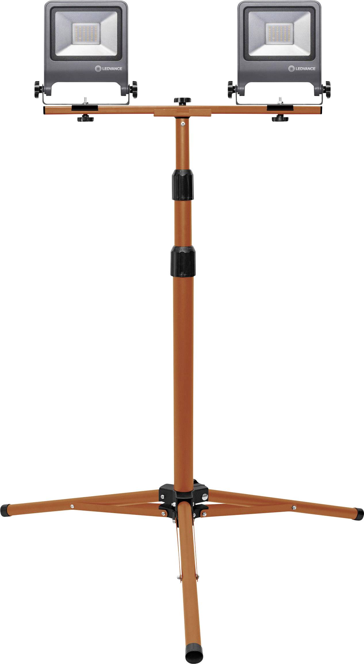 Un projecteur télescopique orange avec deux lampes LED, adapté aux travaux de construction ou de rénovation, est monté sur un trépied.