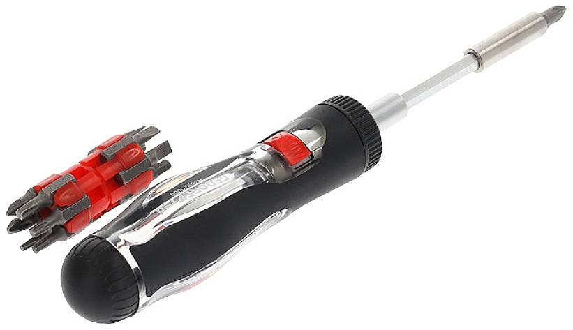 Un tournevis multifonction avec des embouts interchangeables et une poignée ergonomique est posé à côté d'un porte-embouts rouge et noir.