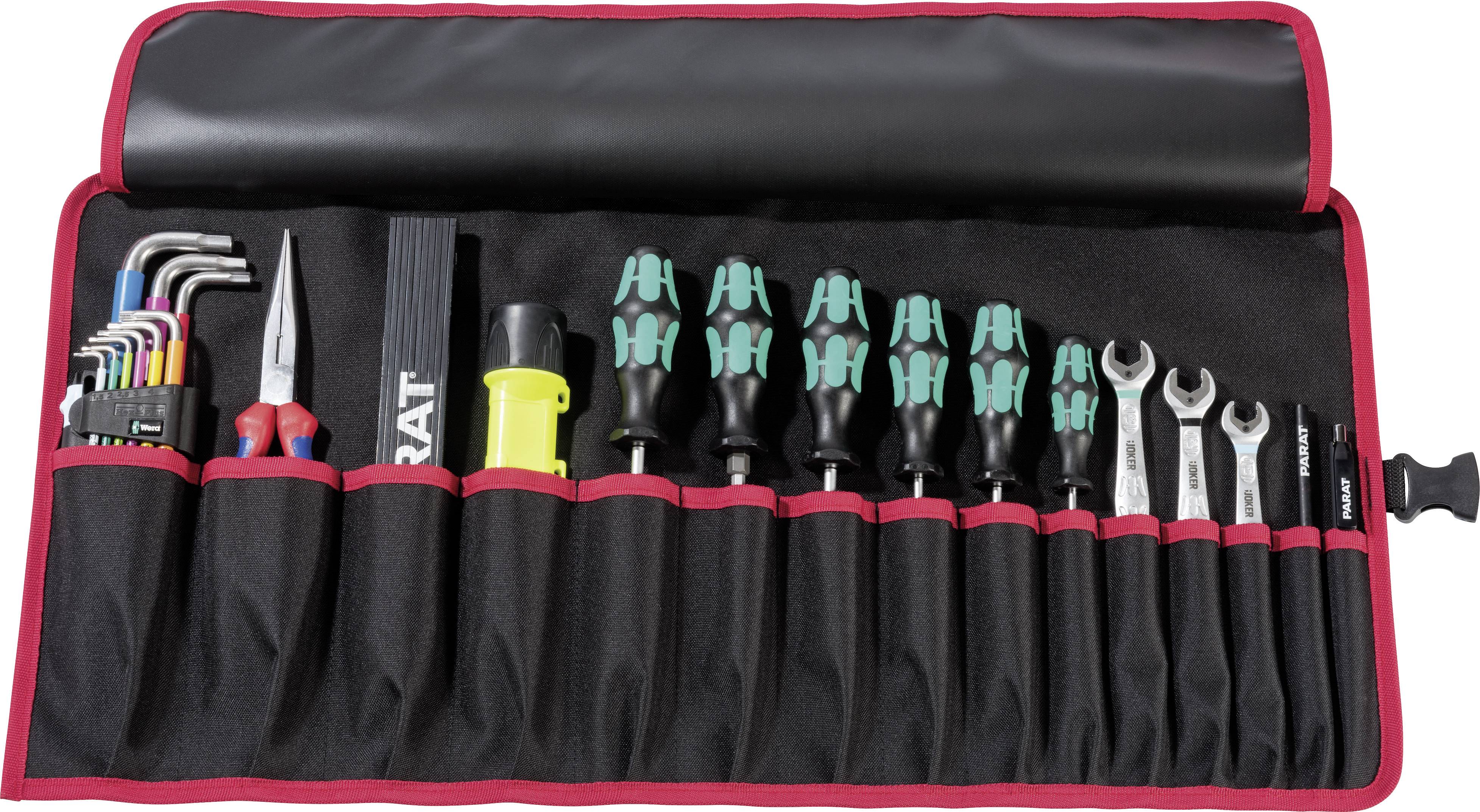 Un ensemble d'outils ouvert avec divers outils manuels tels que des clés hexagonales, des tournevis, des clés à molette et des pinces, rangés dans une trousse en tissu noir et rouge.
