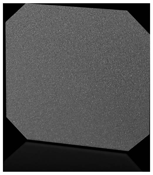 Enduit texturé gris en forme d'octogone tronqué, présenté sur un fond sombre.