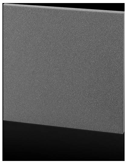 Surface grise rectangulaire aux contours nets avec une texture lisse sur un fond noir.