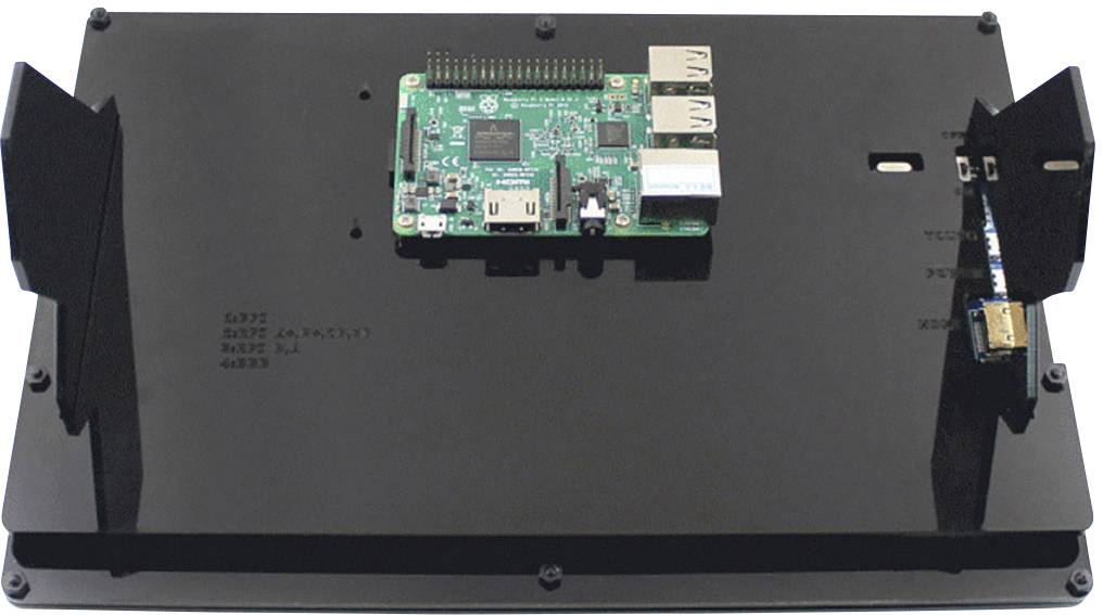 Une carte électronique verte, probablement un Raspberry Pi, est montée au centre d'une plateforme noire.