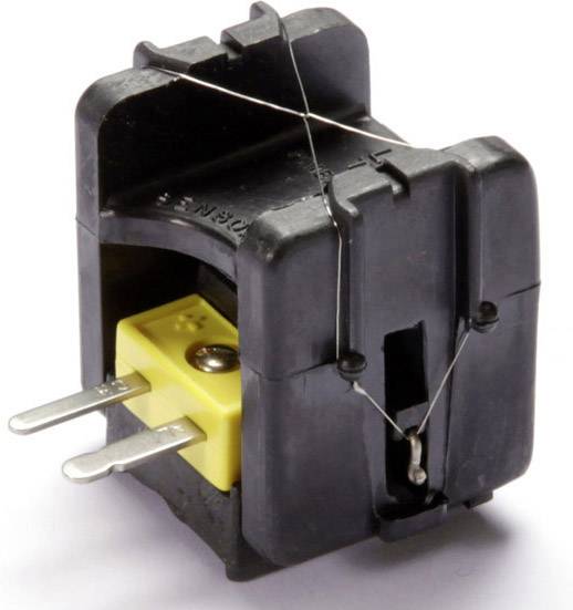 Pièce en plastique noir avec un élément jaune et un attache métallique. Il semble s'agir d'un composant électrique ou d'un fusible.