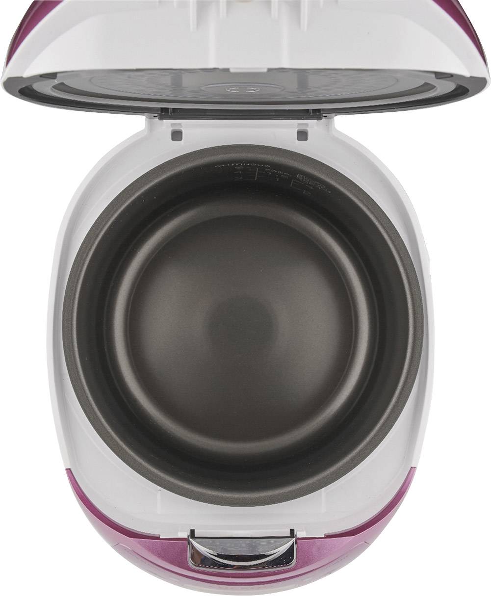 Un rice cooker ouvert avec un récipient intérieur vide et antiadhésif, pris en vue de dessus.
