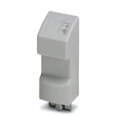 Un composant électronique gris de forme rectangulaire, probablement un adaptateur ou un connecteur, avec des interfaces sur sa face inférieure.