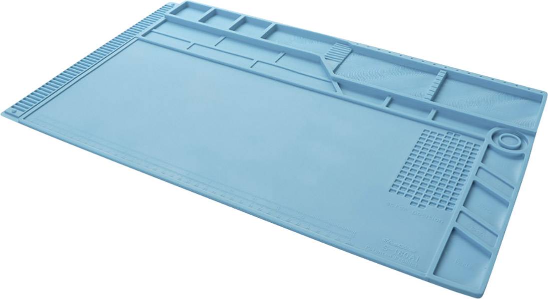Tapis de travail en silicone bleu avec compartiments et repères, utilisé pour les réparations électroniques.