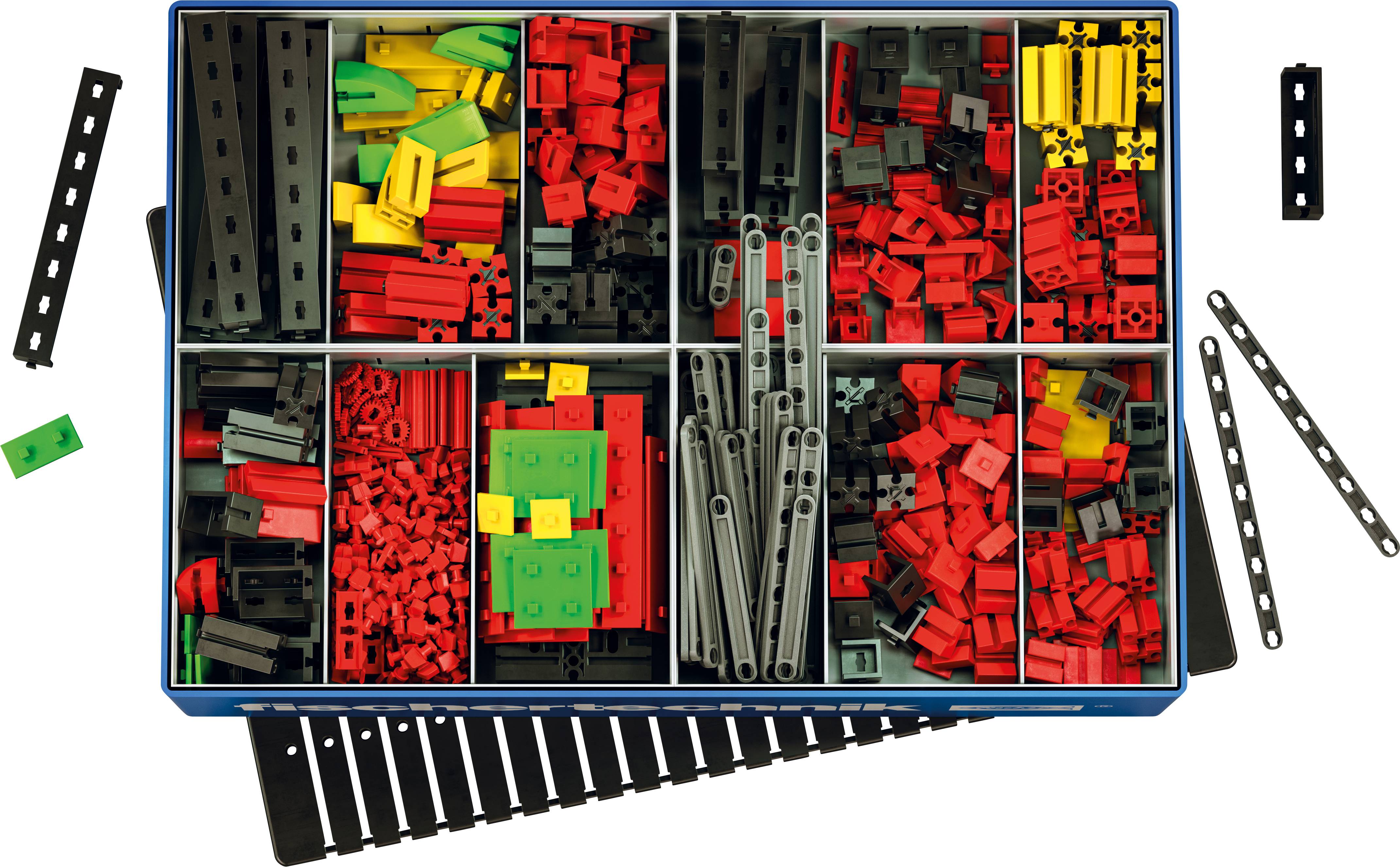 Une boîte d'assortiment contenant des blocs de construction en plastique de différentes couleurs et des pièces de connexion, principalement en rouge, vert, jaune et noir.