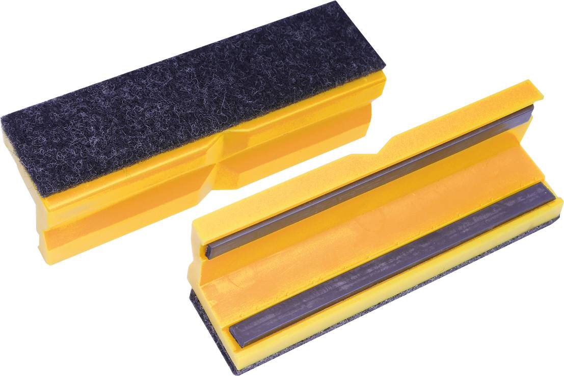 Deux outils en plastique jaune avec des bandes de feutre noir, probablement utilisés comme protection de bords ou cales d'espacement.