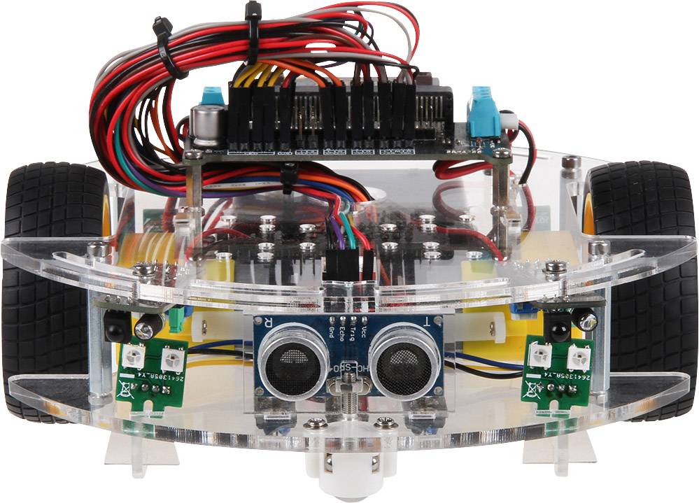 Un robot transparent sur roues avec des câbles rouges et noirs, des capteurs à l'avant et un circuit électronique au-dessus.