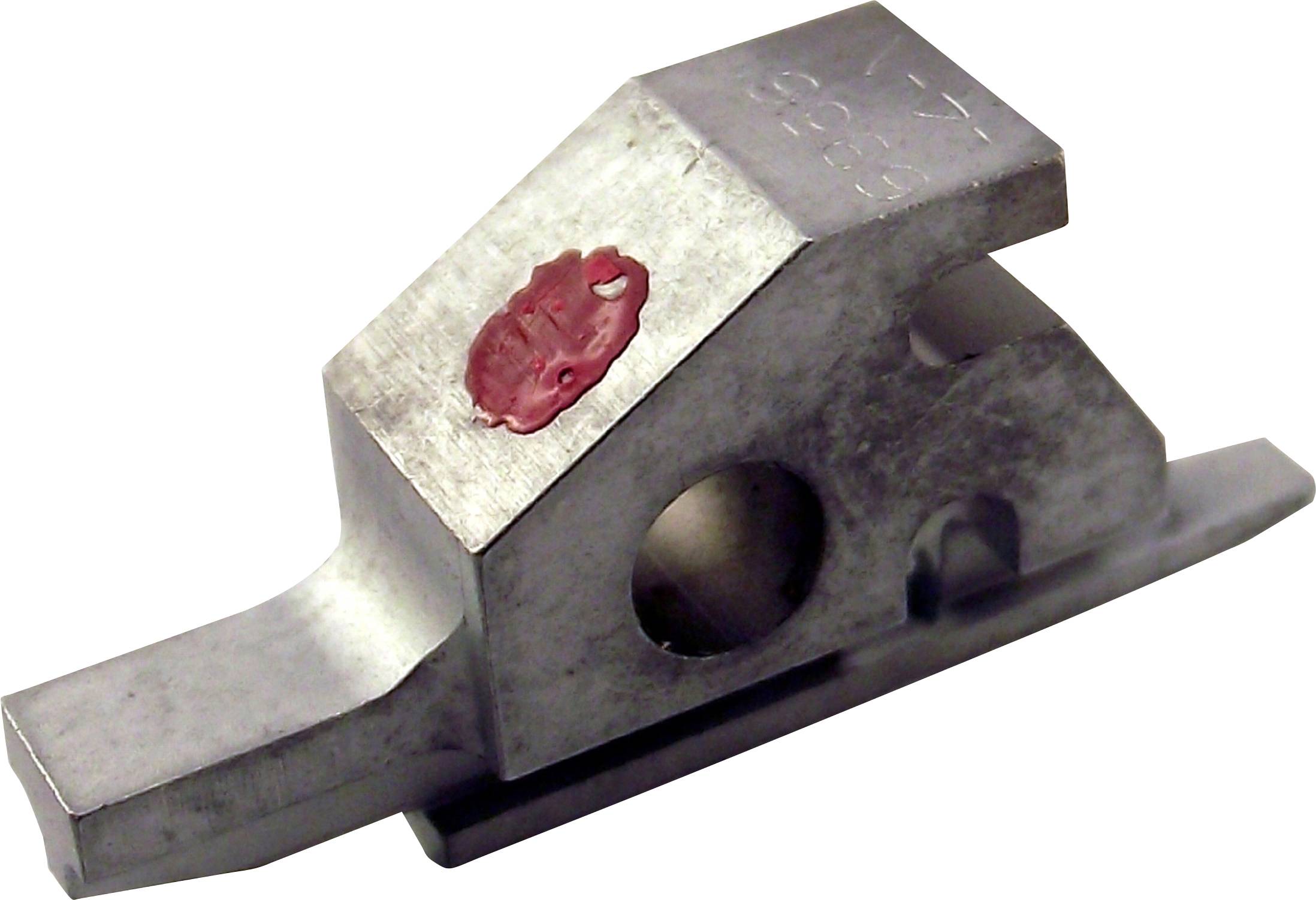 Pièce métallique avec base rectangulaire et trou traversant ; la surface supérieure présente un marquage rouge. La forme et la fonction ne sont pas identifiables spécifiquement.