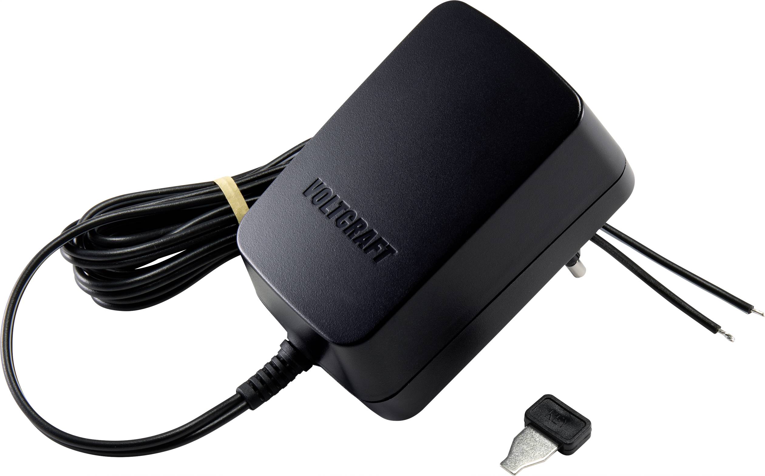 Adaptateur secteur noir avec câble et fiche métallique, à côté d'une petite clé.