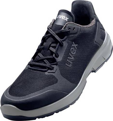 Chaussure de sécurité noire avec semelle grise et logo 'uvex' sur le côté, adaptée aux environnements de travail industriels.
