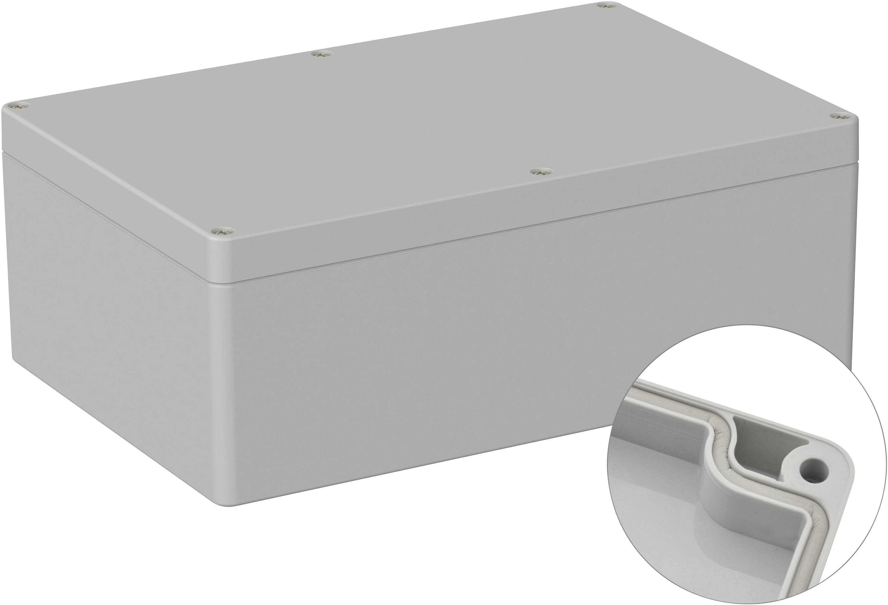 Boîtier rectangulaire gris sans caractéristiques visibles. Un coin agrandi révèle un joint d'étanchéité.