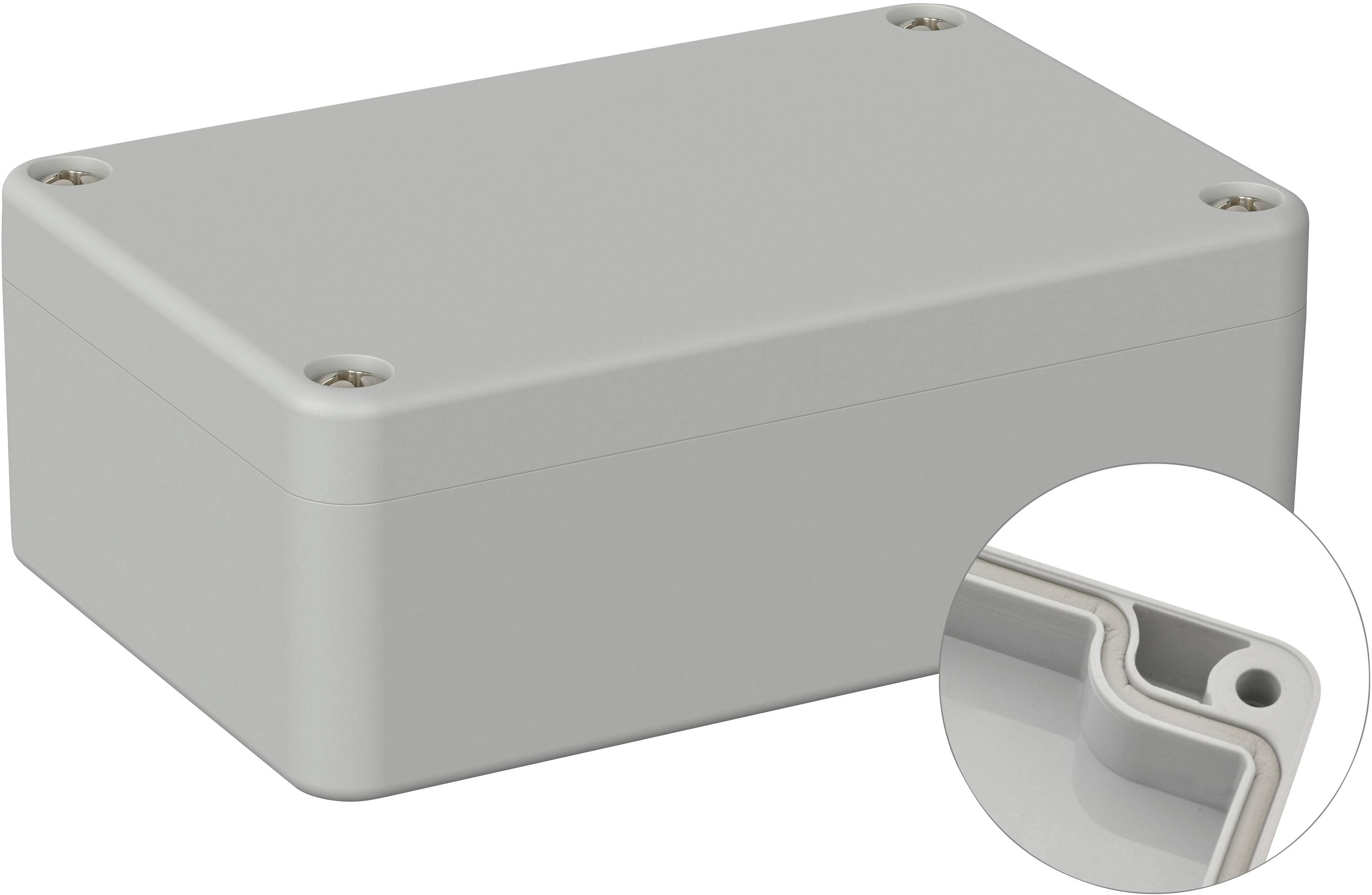 Boîtier rectangulaire gris avec quatre vis aux coins ; un plan détaillé montre un coin arrondi avec un trou de vis.