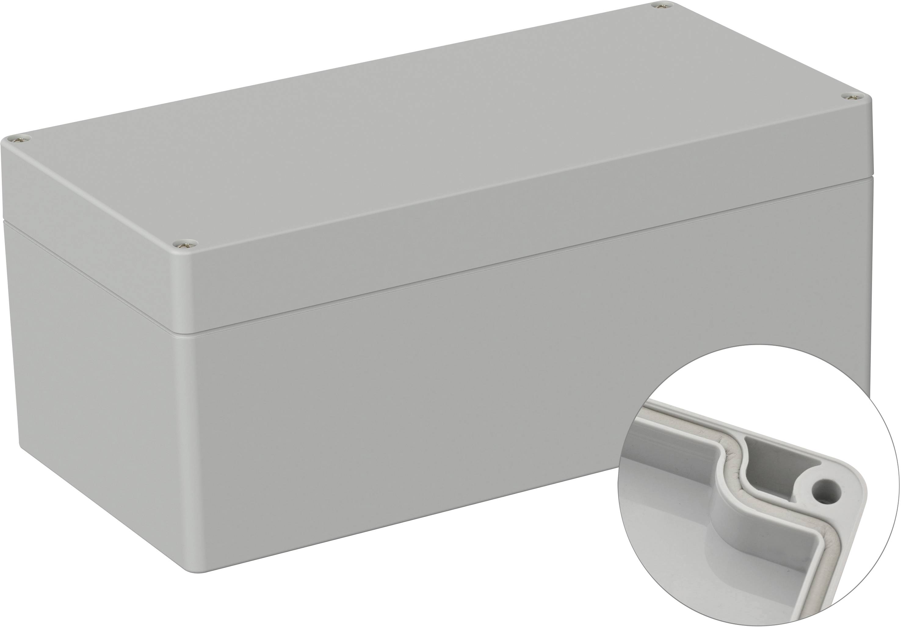 Boîtier en plastique gris, rectangulaire, avec un couvercle amovible. Au premier plan, vue détaillée des bords intérieurs du boîtier.