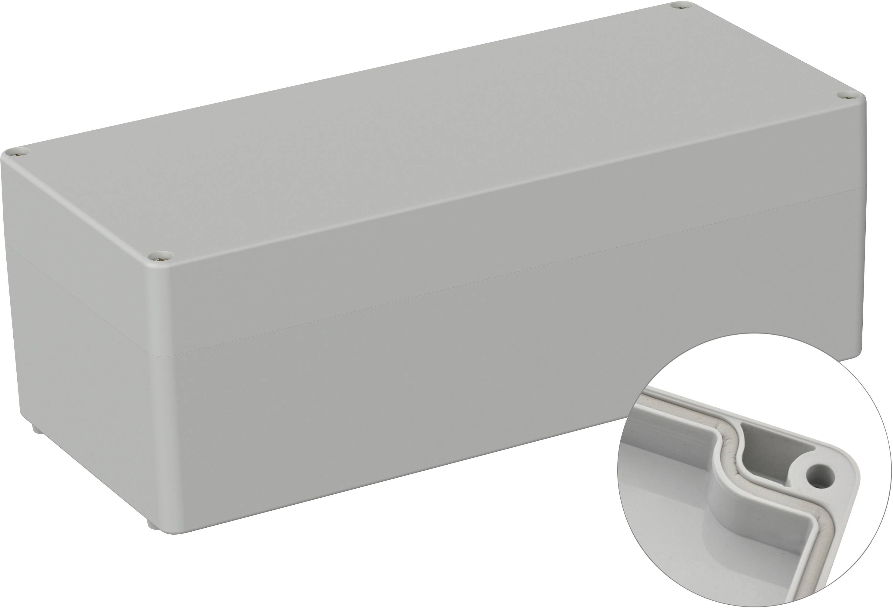 Boîtier rectangulaire gris aux coins arrondis, avec des fermetures à vis sur le dessus et un agrandissement détaillé d'un angle intérieur.