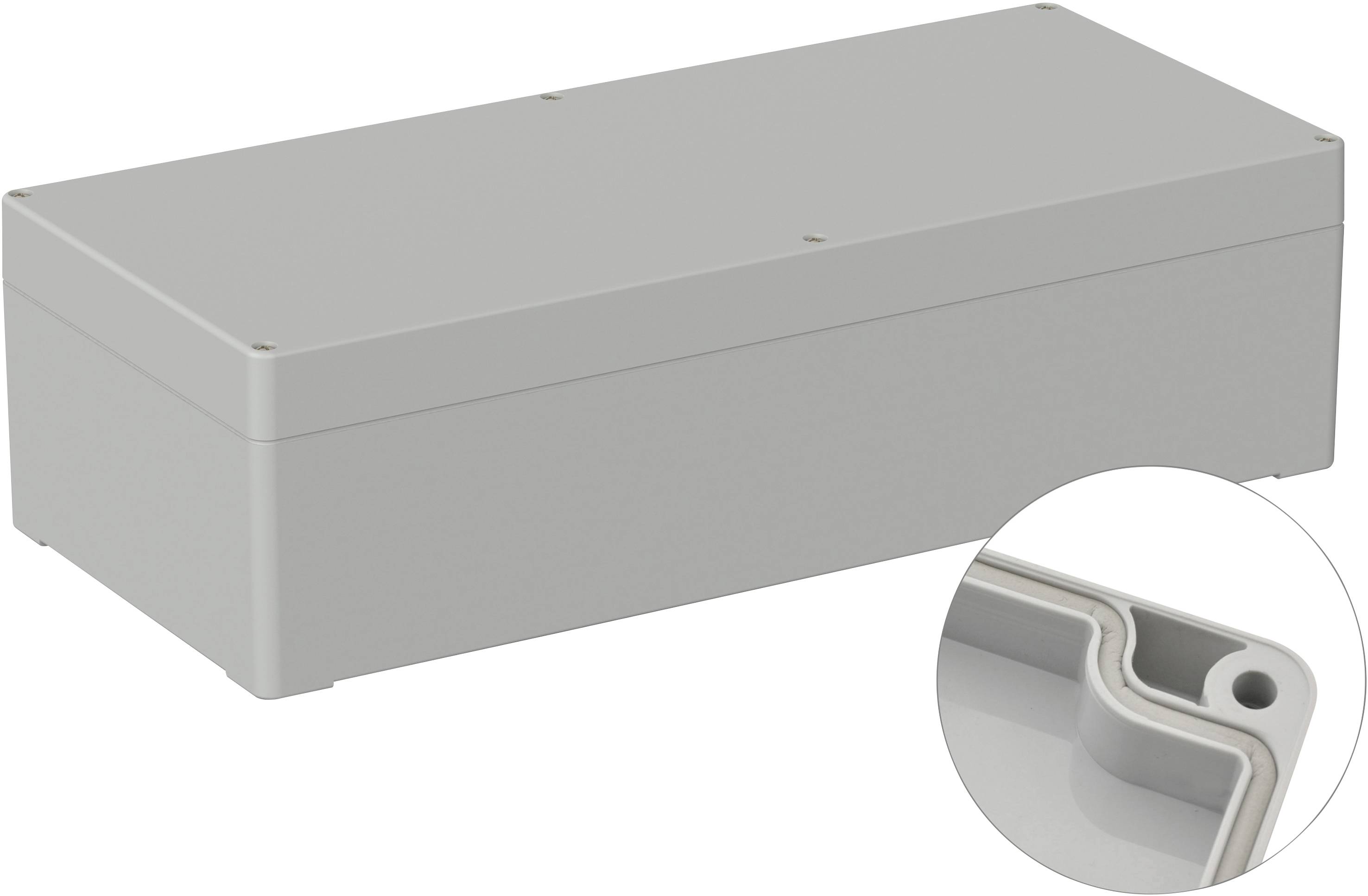 Boîtier rectangulaire gris aux angles arrondis, vue détaillée d'un bord avec une ouverture de vis au premier plan.