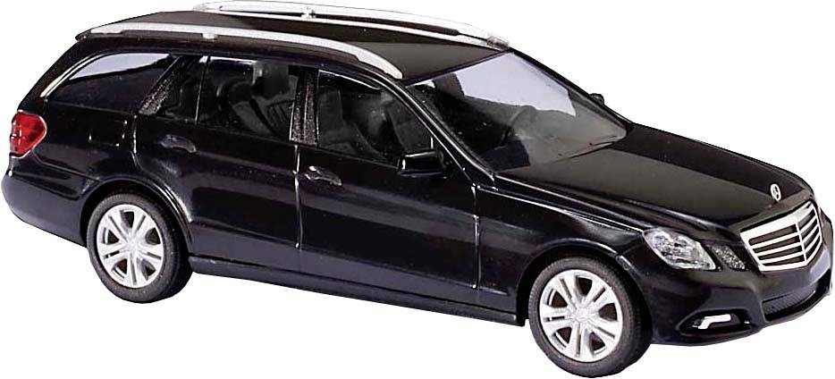 Voiture miniature noire d'un break avec jantes argentées et galerie de toit, représentée de profil gauche.