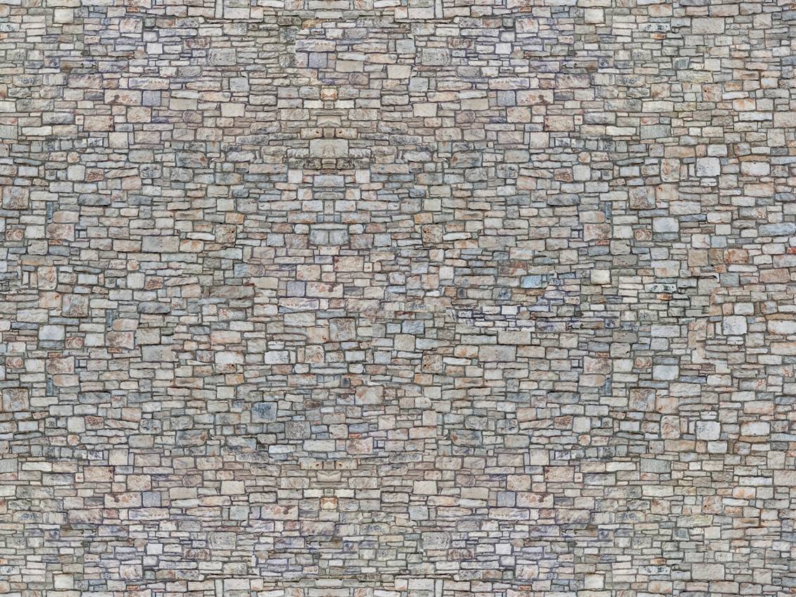 Un mur uniforme composé de pierres grossièrement pavées de différentes couleurs, formant une structure rustique et robuste.