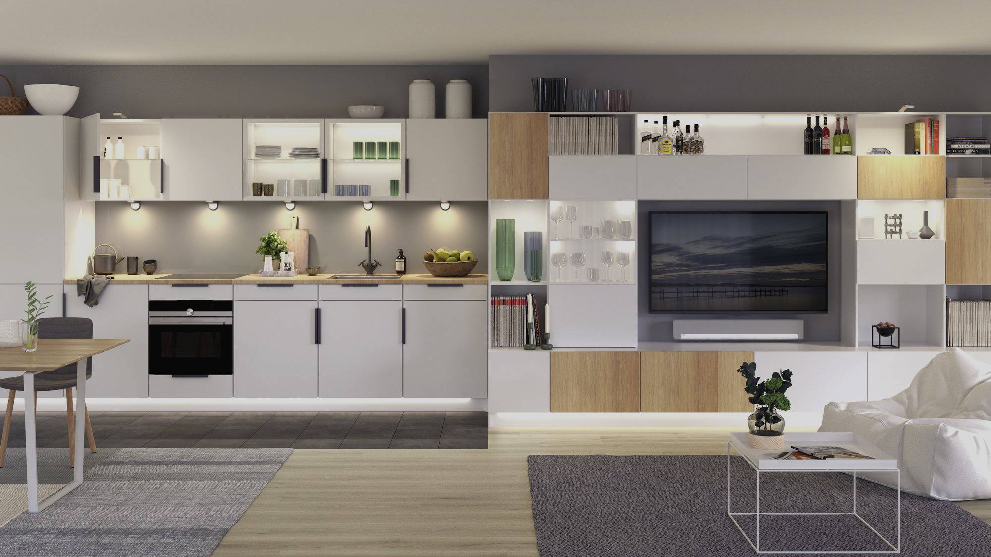 Une cuisine moderne et minimaliste et un salon dans un espace ouvert. Meubles blancs, four encastré, étagères décoratives.