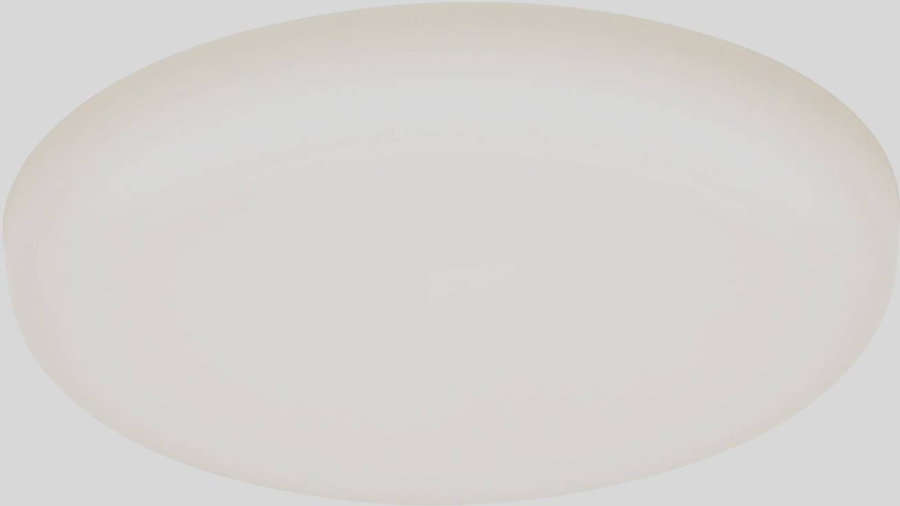 Un luminaire de plafond rond et plat, diffusant une lumière uniforme et douce. Idéal pour les espaces intérieurs modernes et créant une ambiance lumineuse.