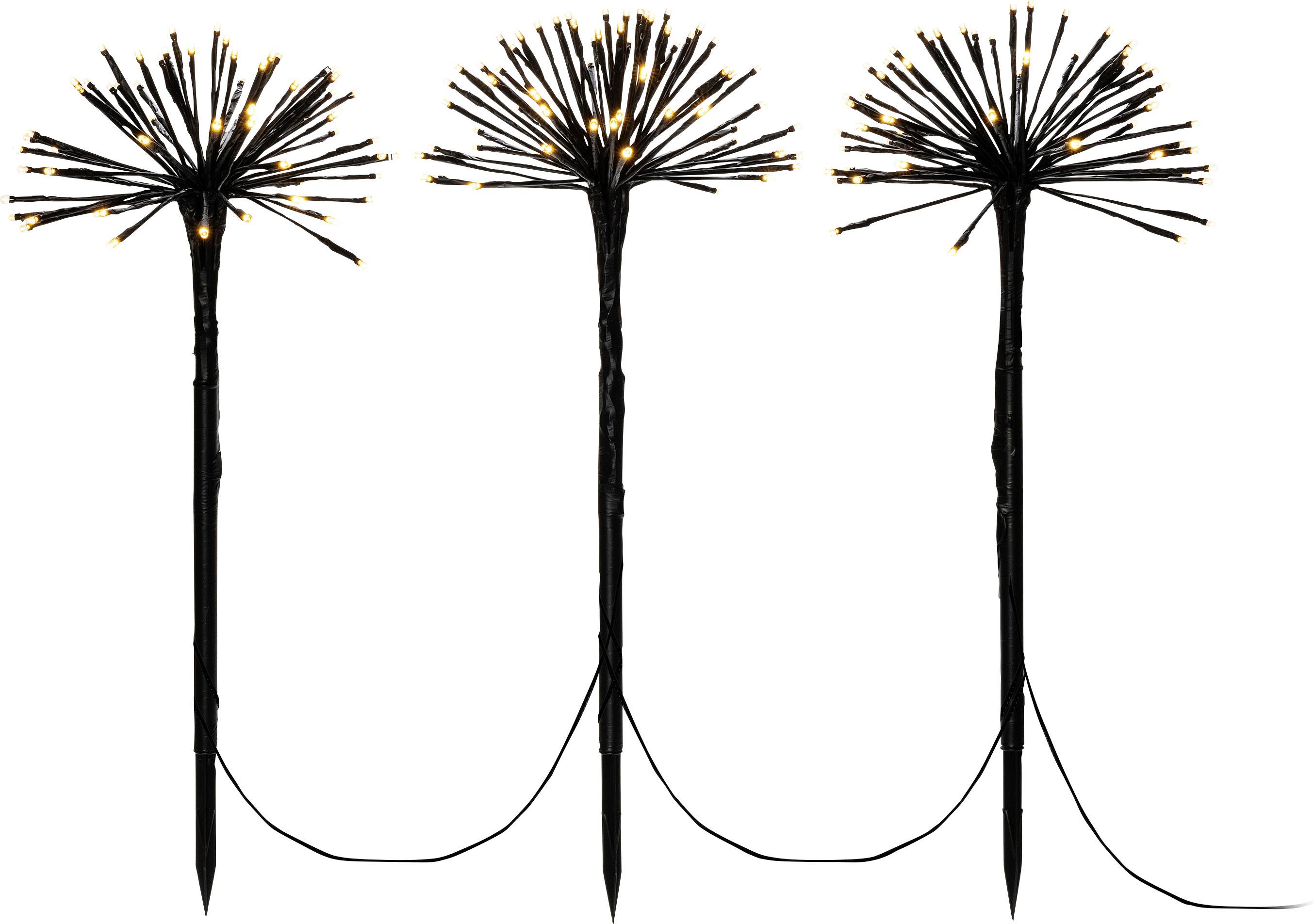 Trois luminaires de jardin en forme de fleurs avec des pointes lumineuses sur des tiges noires, reliés par un câble. Idéal pour un éclairage d'ambiance.