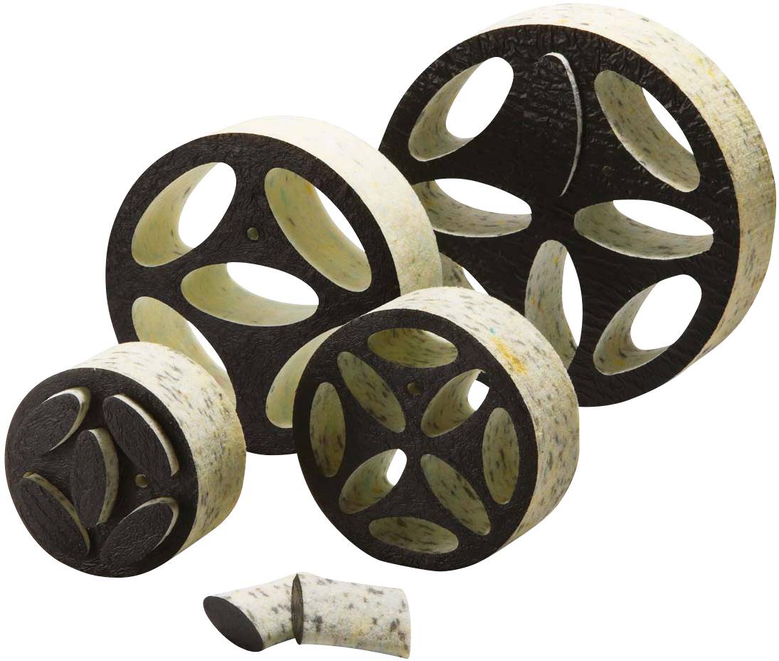 Différentes tailles d'objets ronds à motifs noir et beige, avec des découpes ovales évoquant des engrenages.