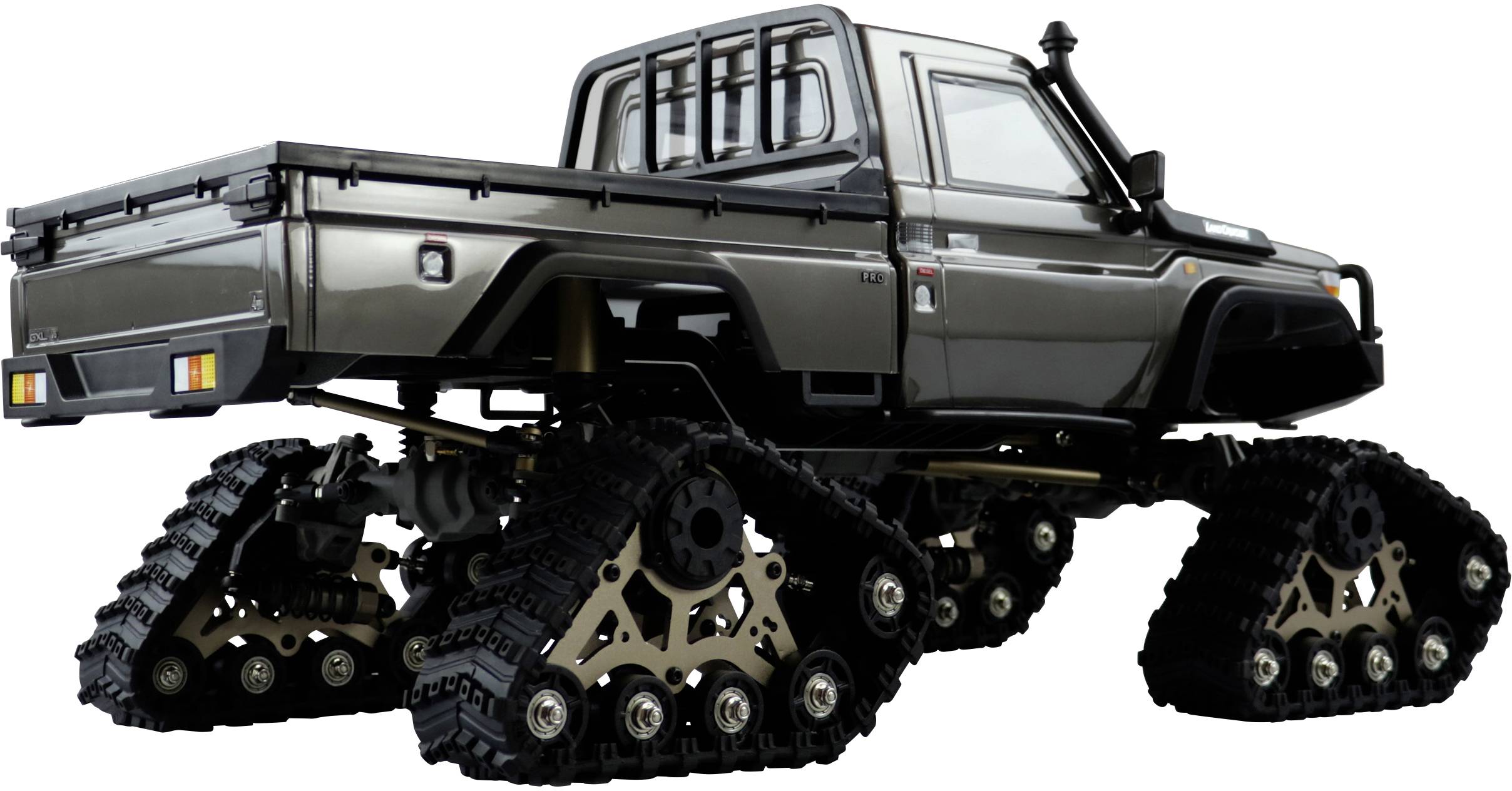 Un camion pick-up sombre à chenilles au lieu de roues, adapté aux terrains difficiles. Le véhicule est stationné sur une surface plane.