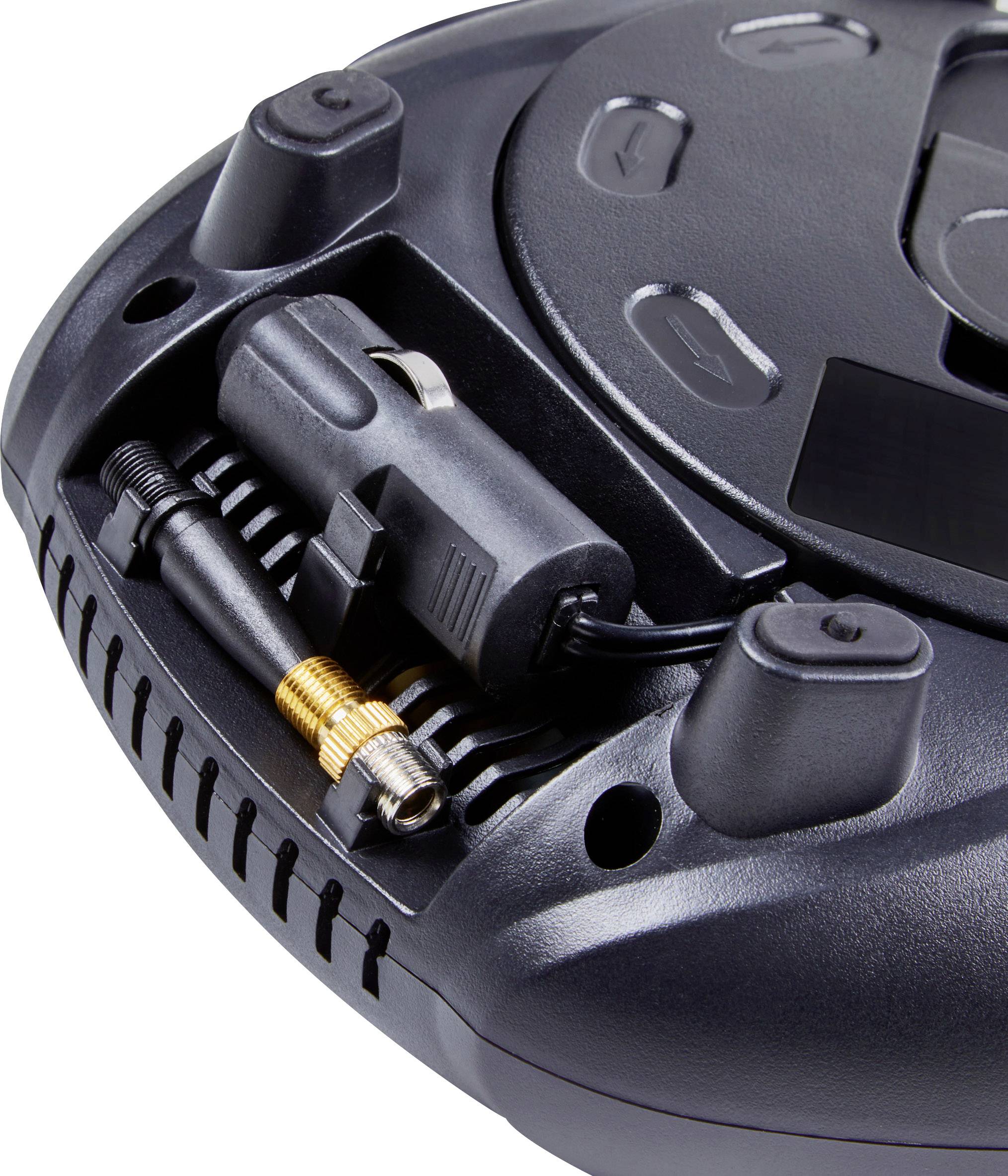 Un aspirateur robot noir et rond avec une zone de connexion mise en évidence, probablement destinée à l'alimentation électrique ou à la connectivité.