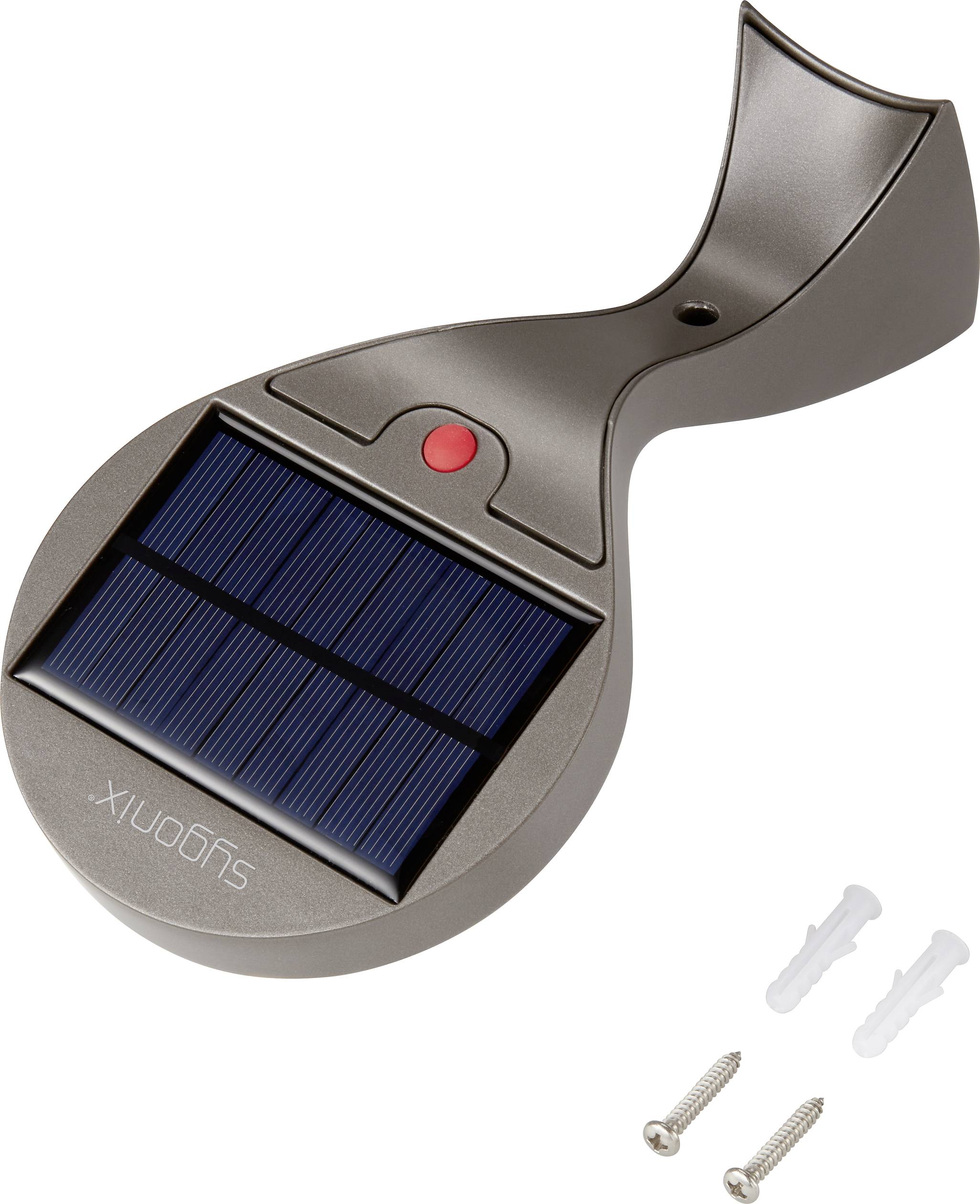 Lampe solaire avec boîtier gris foncé et panneau solaire sur le dessus. Contient un bouton rouge. Deux vis et chevilles sont posées à côté.