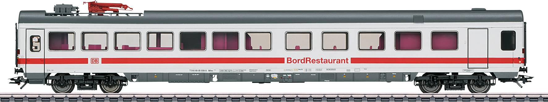 Un wagon blanc et rouge portant l'inscription 'Restaurant de Bord' est stationné sur des rails.