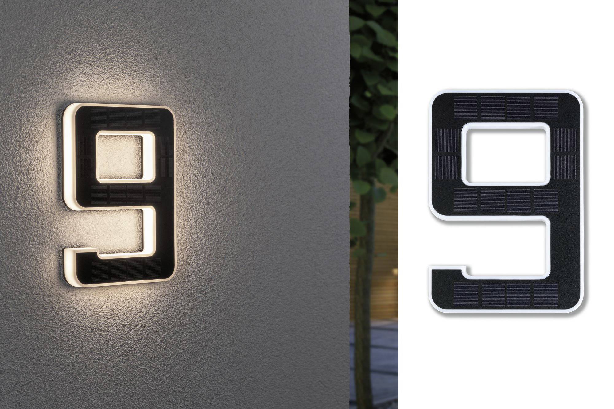 Numéro de maison lumineux '9' sur un mur, illuminant discrètement les alentours.