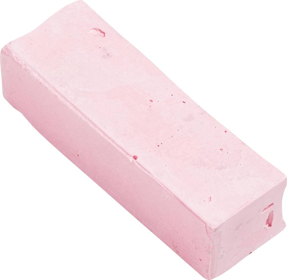 Un morceau de craie rose, de forme rectangulaire et inutilisé, repose sur une surface blanche.