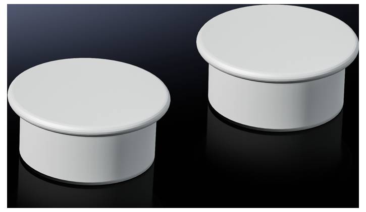 Deux couvercles ronds blancs sur une surface noire.