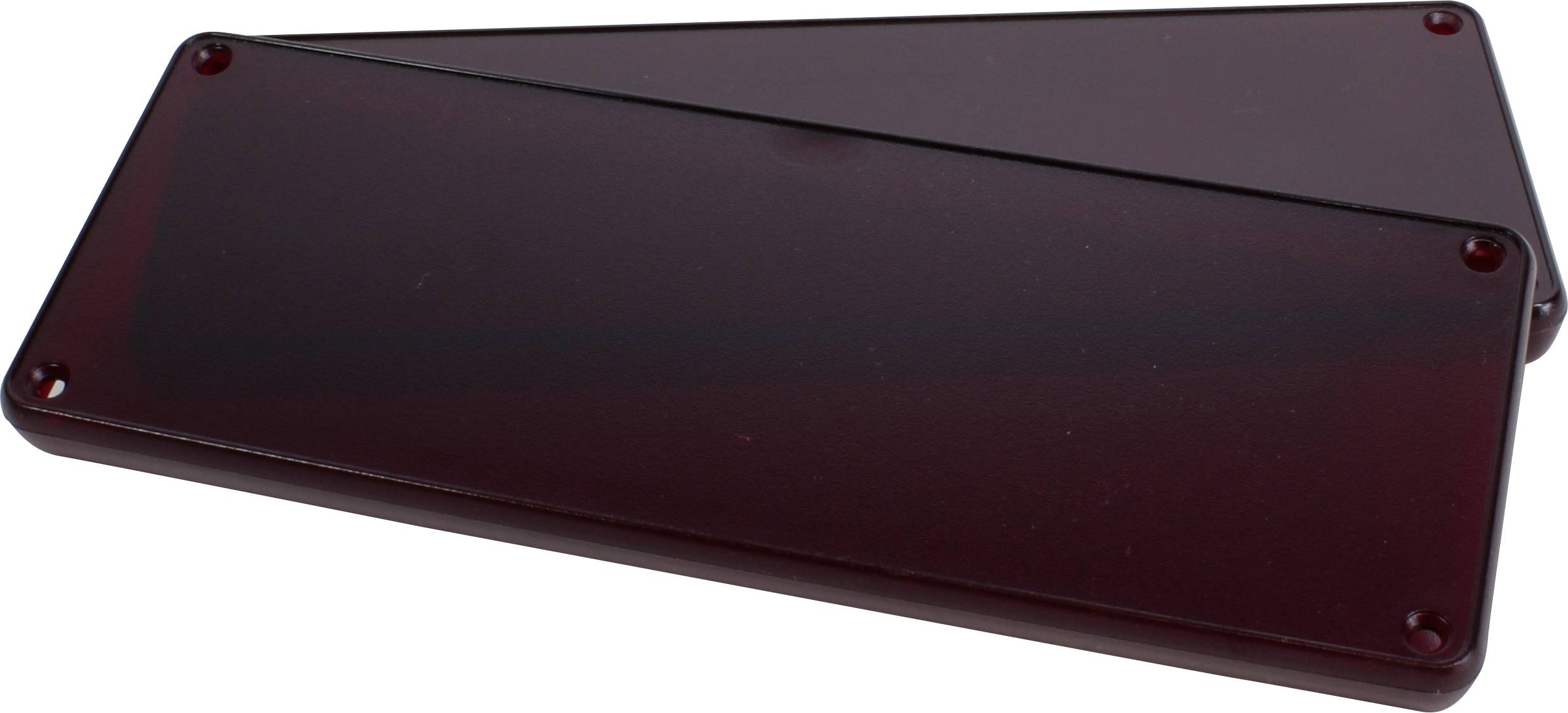 Un couvercle rectangulaire marron en plastique aux coins arrondis repose légèrement incliné sur un couvercle similaire.