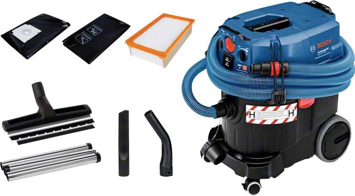 Un aspirateur industriel bleu avec des tuyaux et des accessoires : filtre, embout, sac à poussière et tubes. Adapté pour une utilisation dans des environnements poussiéreux.